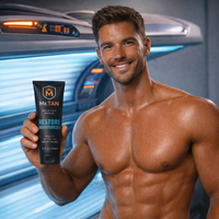 Man Holding a Bottle of Restore After Tan and Daily Moisturizer 